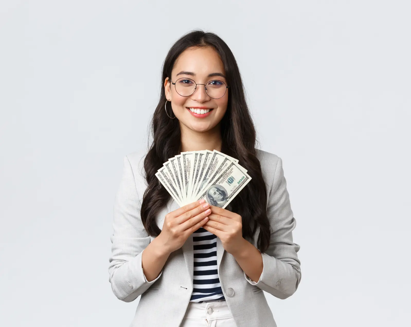 A female student holding money